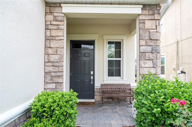 1097 Trappers Trail Loop, Davenport, FL 33896 - entrance to property with stone siding and stucco siding