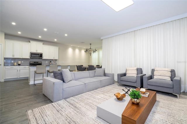 1097 Trappers Trail Loop, Davenport, FL 33896 - living area featuring a chandelier, dark wood-type flooring, and recessed lighting