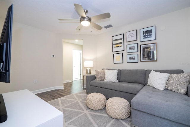 1097 Trappers Trail Loop, Davenport, FL 33896 - living area with dark wood-style floors and a ceiling fan