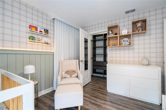 1097 Trappers Trail Loop, Davenport, FL 33896 - living area featuring wallpapered walls, dark wood-type flooring, and a wainscoted wall