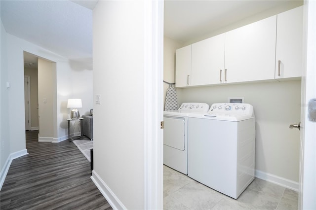 1097 Trappers Trail Loop, Davenport, FL 33896 - washroom featuring separate washer and dryer and cabinet space