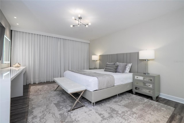 1097 Trappers Trail Loop, Davenport, FL 33896 - bedroom featuring wood finished floors and a chandelier