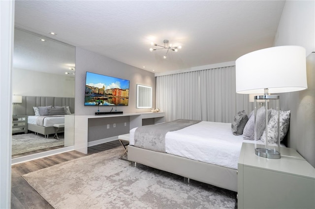1097 Trappers Trail Loop, Davenport, FL 33896 - bedroom featuring wood finished floors, a chandelier, and recessed lighting