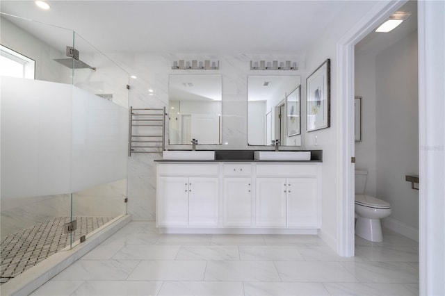 1097 Trappers Trail Loop, Davenport, FL 33896 - full bathroom with double vanity, marble look tiles, a shower stall, and a towel warming rack