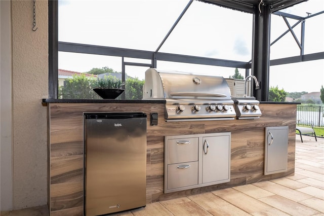 1097 Trappers Trail Loop, Davenport, FL 33896 - view of patio / terrace with exterior kitchen and glass enclosure