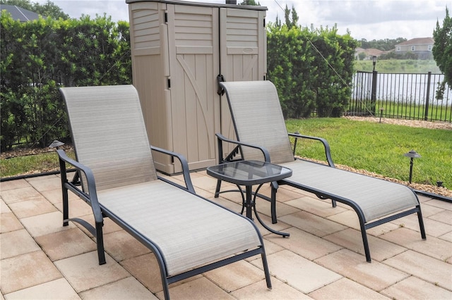 1097 Trappers Trail Loop, Davenport, FL 33896 - view of patio / terrace featuring a storage shed