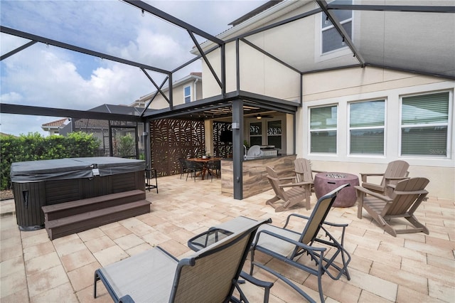 1097 Trappers Trail Loop, Davenport, FL 33896 - view of patio with a hot tub, a fire pit, glass enclosure, an outdoor kitchen, and outdoor dining area
