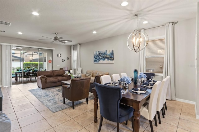2121 Morocco Way, Kissimmee, FL 34747 - dining room with recessed lighting, a chandelier, a ceiling fan, and light tile patterned floors