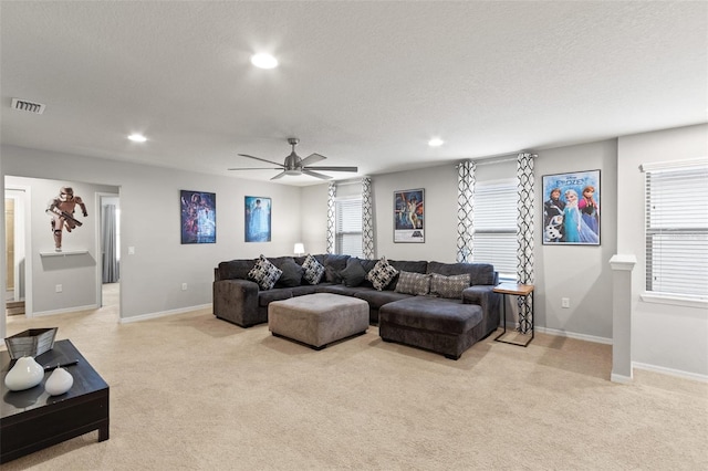 2121 Morocco Way, Kissimmee, FL 34747 - living room with light carpet, recessed lighting, a ceiling fan, and a textured ceiling