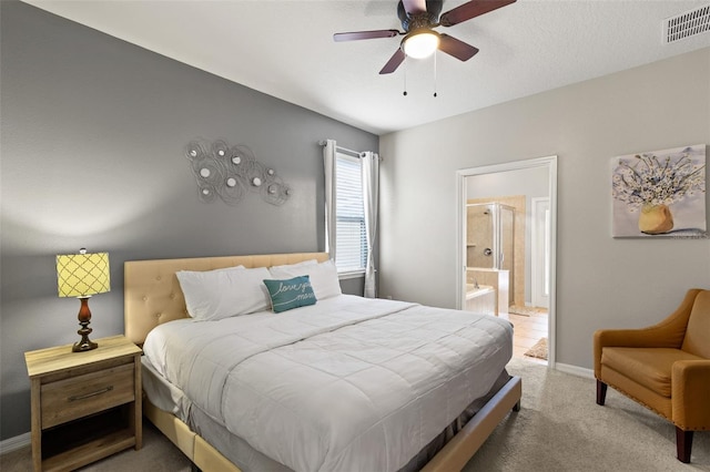 2121 Morocco Way, Kissimmee, FL 34747 - carpeted bedroom with ensuite bathroom and ceiling fan