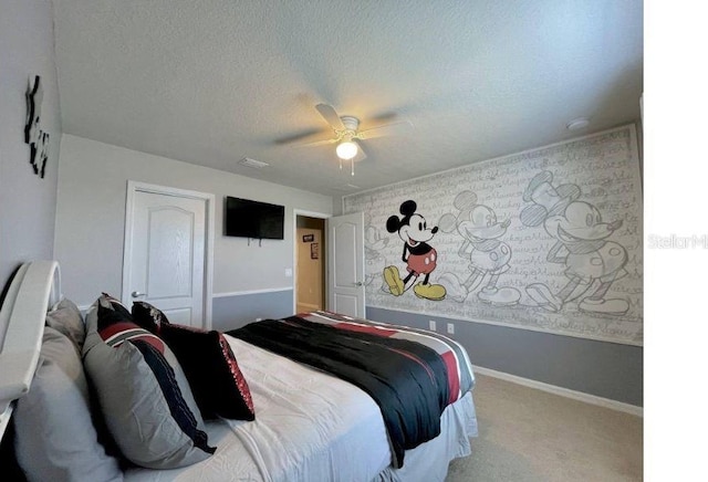 2121 Morocco Way, Kissimmee, FL 34747 - carpeted bedroom with a textured ceiling and a ceiling fan