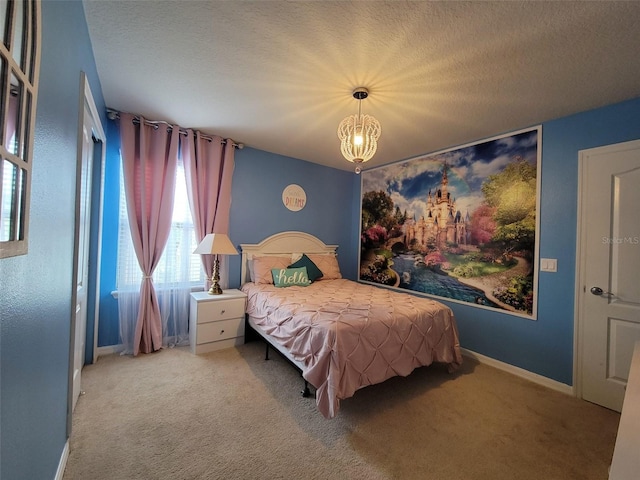 2121 Morocco Way, Kissimmee, FL 34747 - carpeted bedroom featuring a chandelier and a textured ceiling