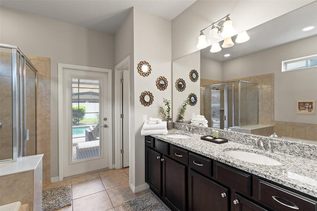 2121 Morocco Way, Kissimmee, FL 34747 - bathroom with a shower stall, double vanity, tile patterned flooring, and a bath