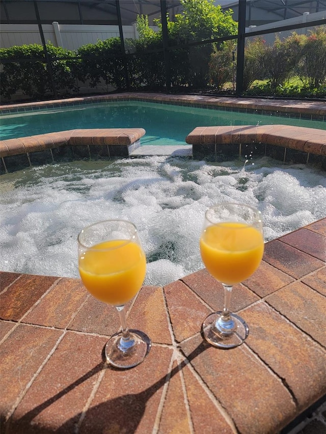 2121 Morocco Way, Kissimmee, FL 34747 - view of swimming pool with a pool with connected hot tub and a lanai