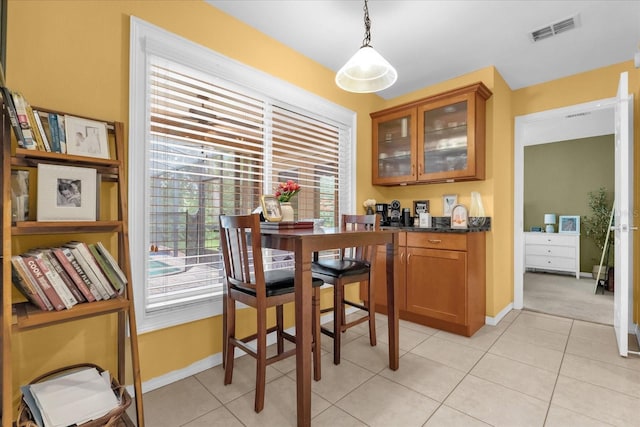 9275 Lake Sharp Ct, Orlando, FL 32817 - dining room with healthy amount of natural light and light tile patterned floors