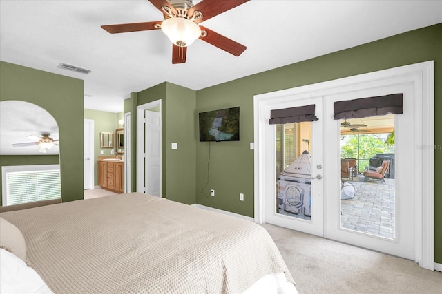 9275 Lake Sharp Ct, Orlando, FL 32817 - bedroom with access to outside, light carpet, multiple windows, and ensuite bathroom