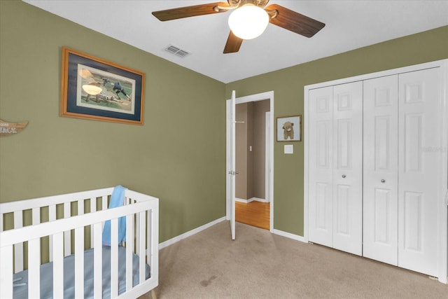 9275 Lake Sharp Ct, Orlando, FL 32817 - bedroom featuring carpet flooring, a closet, a ceiling fan, and a nursery area