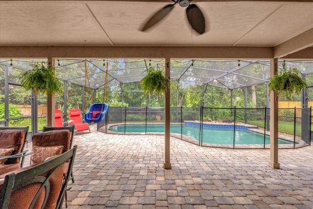 9275 Lake Sharp Ct, Orlando, FL 32817 - view of swimming pool with a patio area, a ceiling fan, and glass enclosure