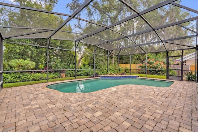 9275 Lake Sharp Ct, Orlando, FL 32817 - view of pool featuring a patio area, a fenced backyard, and glass enclosure