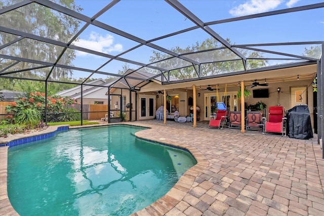 9275 Lake Sharp Ct, Orlando, FL 32817 - view of swimming pool featuring ceiling fan, french doors, a patio, and area for grilling