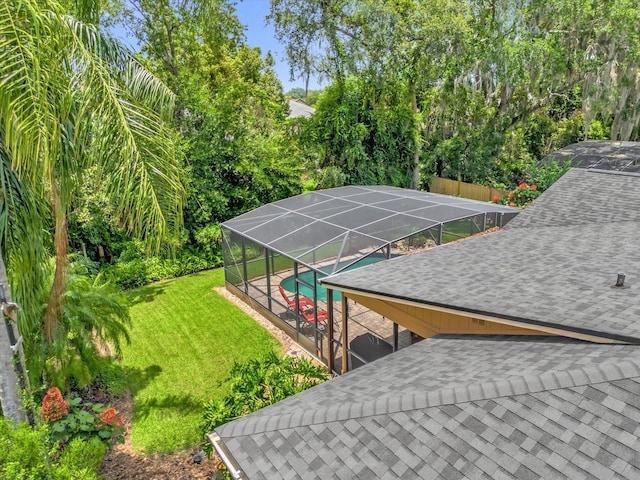 9275 Lake Sharp Ct, Orlando, FL 32817 - view of grassy yard with an outdoor pool and a lanai