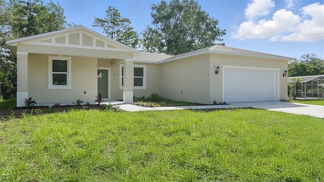 17 Cypress Run, Haines City, FL 33844 - view of front of home featuring a garage, stucco siding, a front lawn, and concrete driveway