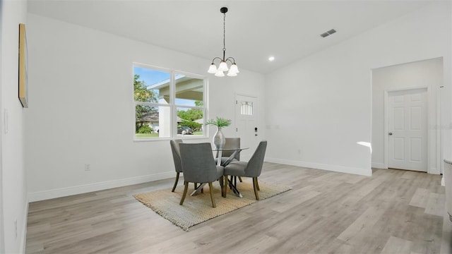17 Cypress Run, Haines City, FL 33844 - dining area with light wood-type flooring, a chandelier, and recessed lighting