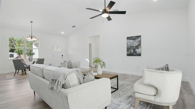 17 Cypress Run, Haines City, FL 33844 - living room with wood finished floors, a chandelier, ceiling fan, recessed lighting, and high vaulted ceiling
