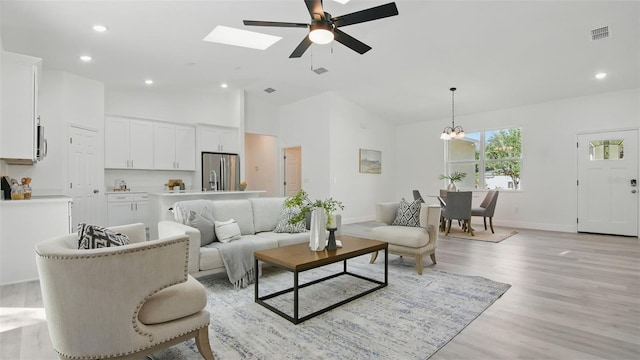 17 Cypress Run, Haines City, FL 33844 - living area featuring ceiling fan, light wood finished floors, recessed lighting, a chandelier, and high vaulted ceiling