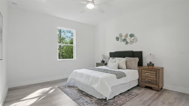 17 Cypress Run, Haines City, FL 33844 - bedroom with light wood finished floors and a ceiling fan