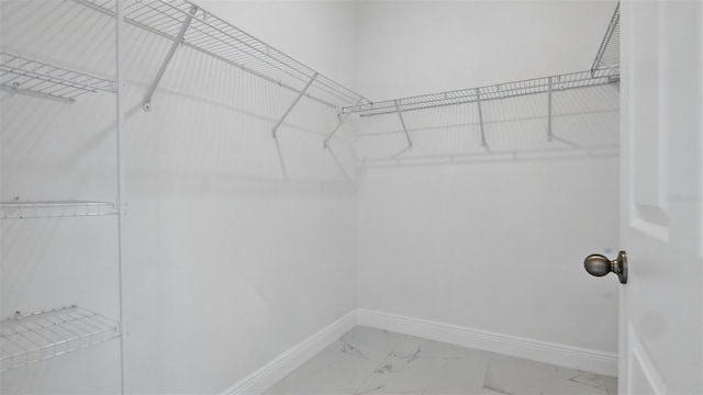 17 Cypress Run, Haines City, FL 33844 - walk in closet featuring marble finish floors
