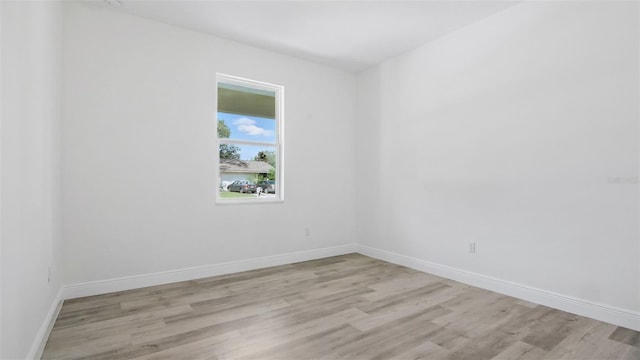 17 Cypress Run, Haines City, FL 33844 - spare room with light wood-type flooring and baseboards