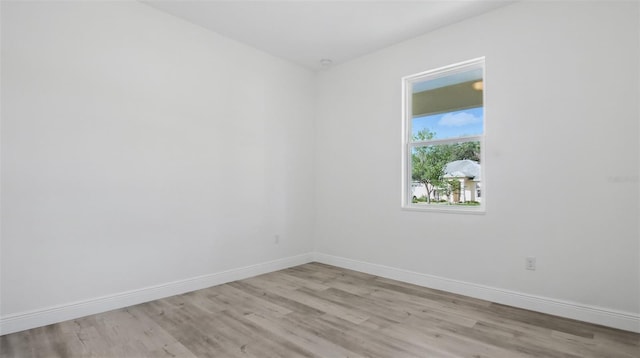 17 Cypress Run, Haines City, FL 33844 - empty room with light wood-style flooring and baseboards