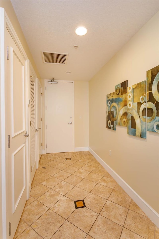 101 S Eola Dr Unit 1021, Orlando, FL 32801 - hall featuring light tile patterned flooring and recessed lighting