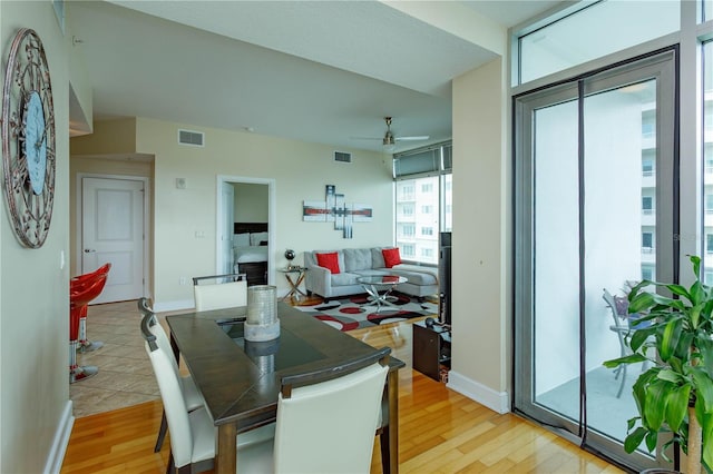 101 S Eola Dr Unit 1021, Orlando, FL 32801 - dining area with a ceiling fan and light wood finished floors