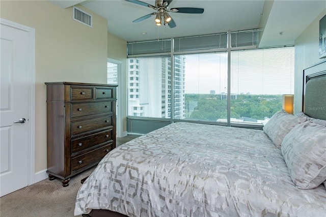 101 S Eola Dr Unit 1021, Orlando, FL 32801 - bedroom with carpet floors, a ceiling fan, and access to outside