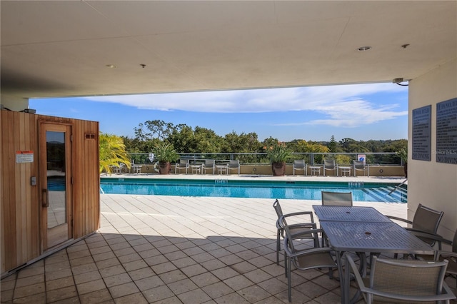 101 S Eola Dr Unit 1021, Orlando, FL 32801 - community pool with a patio and outdoor dining space