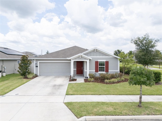 561 Andrea Cir S, Haines City, FL 33844 - ranch-style house with a garage, concrete driveway, and a front yard