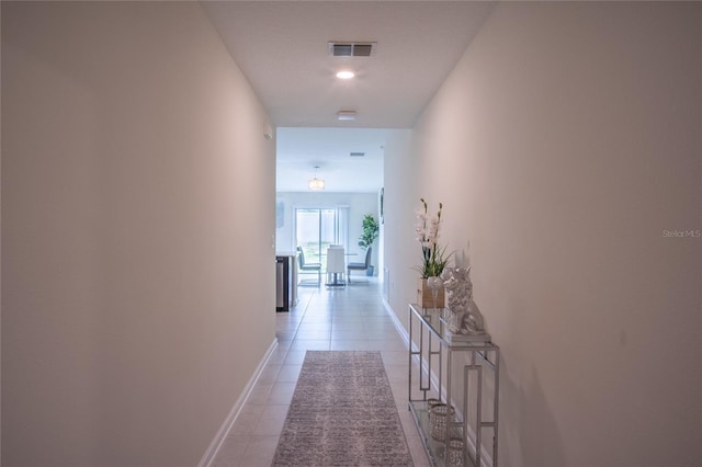 561 Andrea Cir S, Haines City, FL 33844 - hallway with light tile patterned floors and baseboards