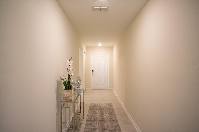 561 Andrea Cir S, Haines City, FL 33844 - hall with light tile patterned flooring and baseboards