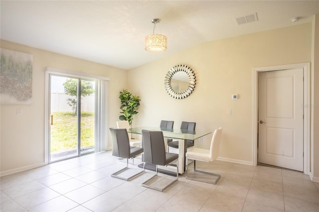 561 Andrea Cir S, Haines City, FL 33844 - dining area featuring baseboards and light tile patterned floors