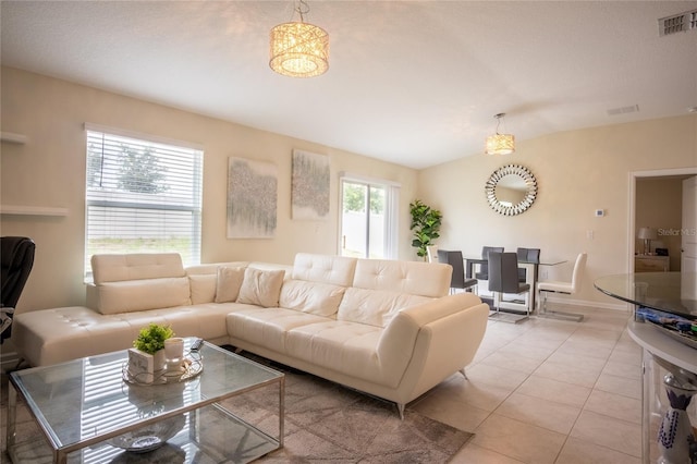 561 Andrea Cir S, Haines City, FL 33844 - living area featuring light tile patterned floors and lofted ceiling