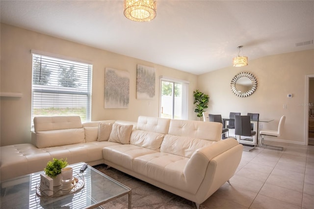 561 Andrea Cir S, Haines City, FL 33844 - living room with tile patterned floors and vaulted ceiling