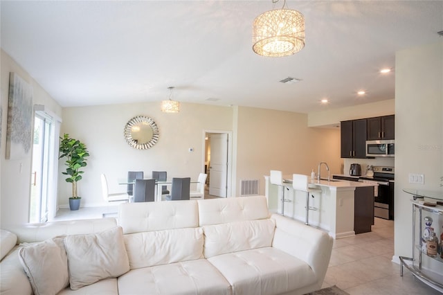 561 Andrea Cir S, Haines City, FL 33844 - living area with a chandelier, light tile patterned floors, and recessed lighting