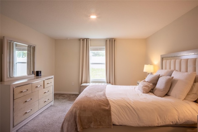 561 Andrea Cir S, Haines City, FL 33844 - bedroom featuring light colored carpet and baseboards