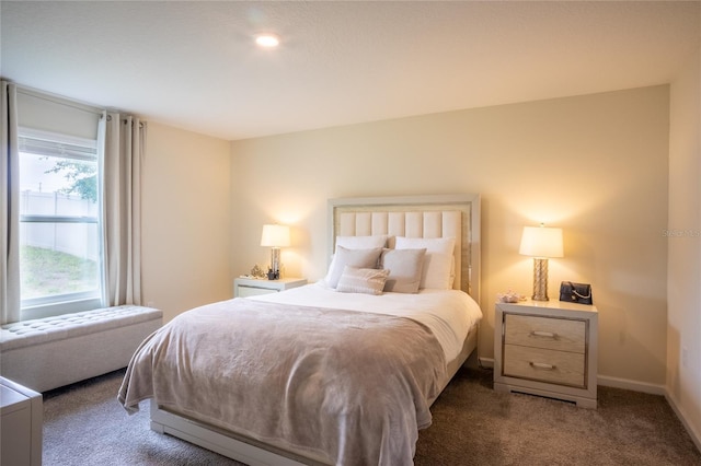 561 Andrea Cir S, Haines City, FL 33844 - bedroom with carpet and baseboards