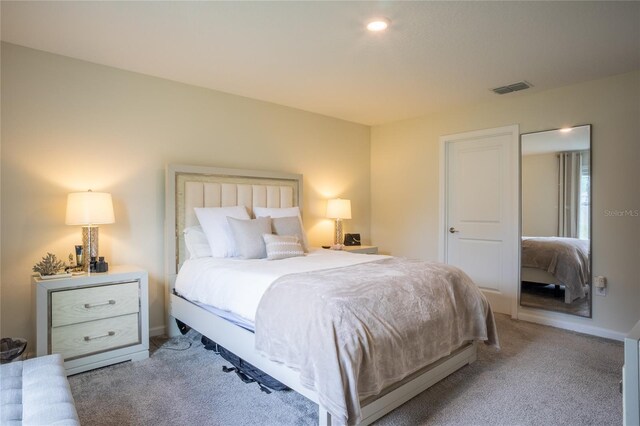 561 Andrea Cir S, Haines City, FL 33844 - bedroom featuring light carpet