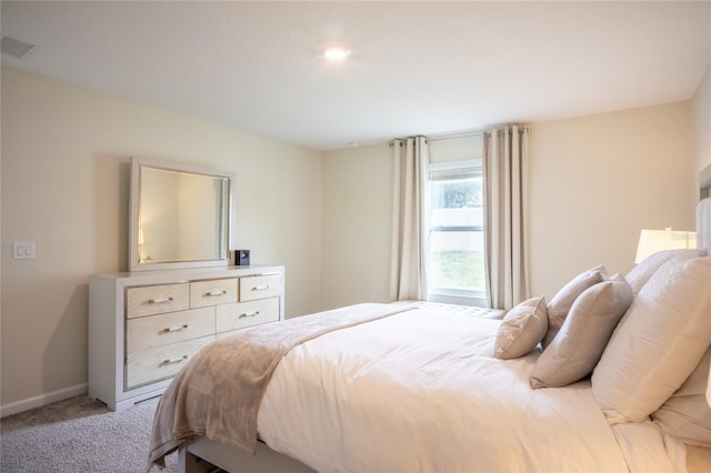 561 Andrea Cir S, Haines City, FL 33844 - bedroom with light colored carpet and baseboards