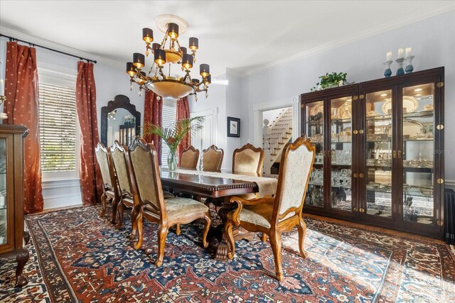 8407 Interbay Blvd, Tampa, FL 33616 - dining space with a chandelier, crown molding, stairs, and wood finished floors