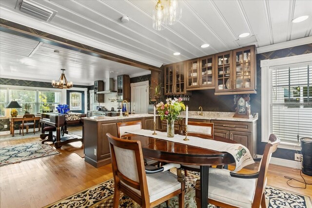 8407 Interbay Blvd, Tampa, FL 33616 - dining area with a chandelier, wood finished floors, crown molding, and recessed lighting